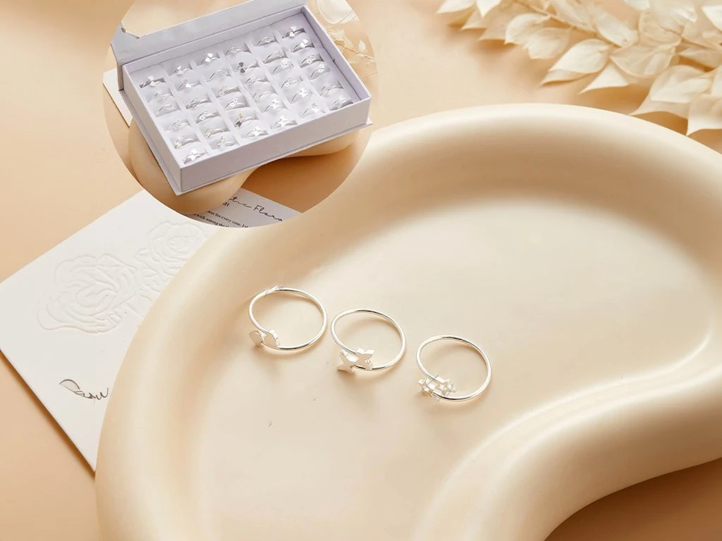 ANILLO ACERO BLANCO CON FORMAS MARIPOSA / ESTRELLA