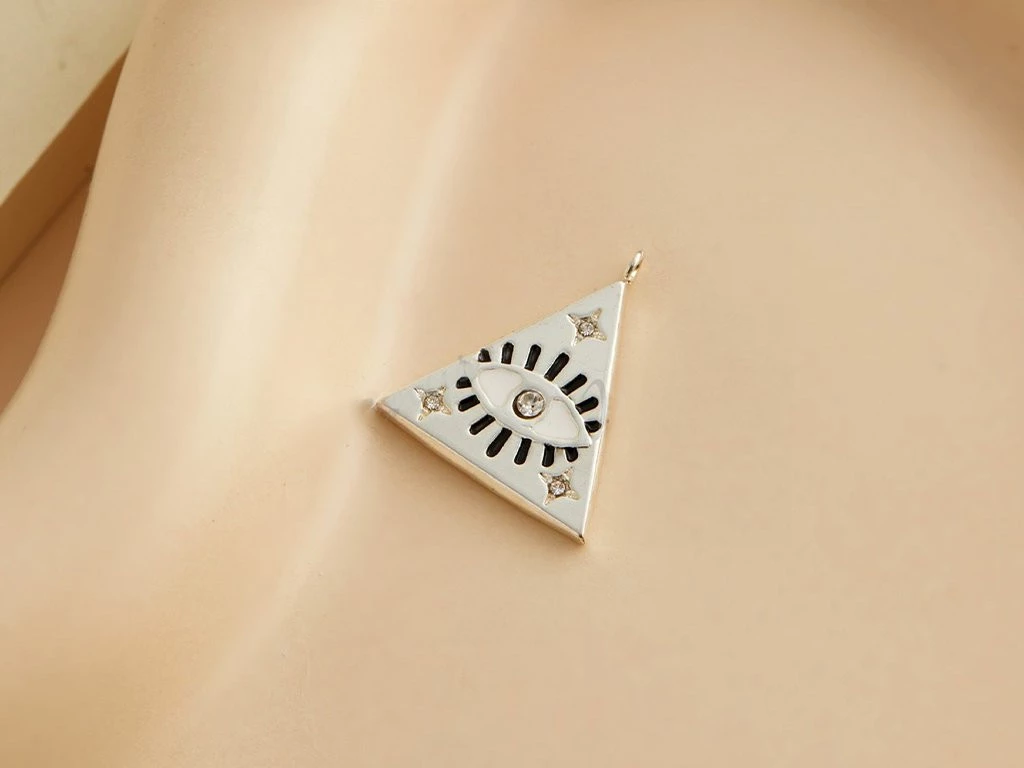 DIJE ACERO BLANCO OJITO TRIANGULO CON STRASS