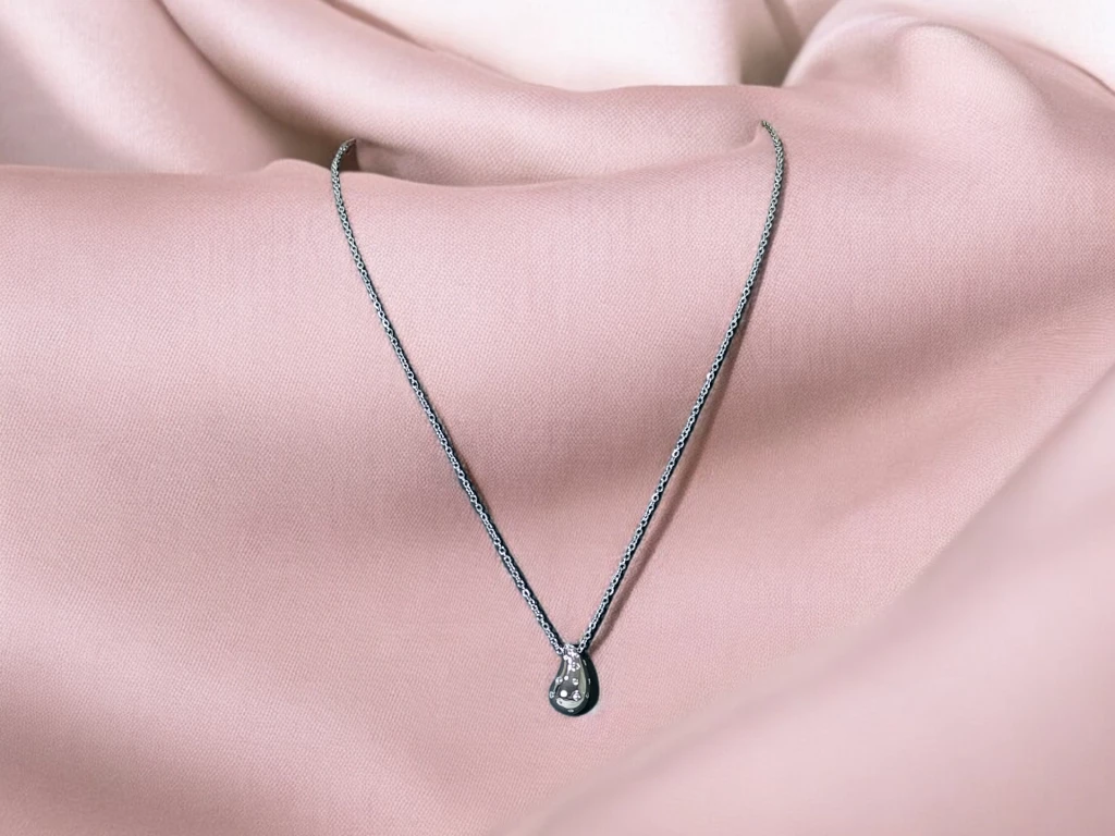 CADENA ACERO CON DIJE BRONCE GOTA CON STRASS
