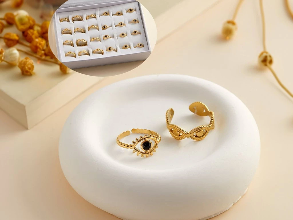 ANILLO ACERO DORADO FORMAS OJITOS SURTIDO