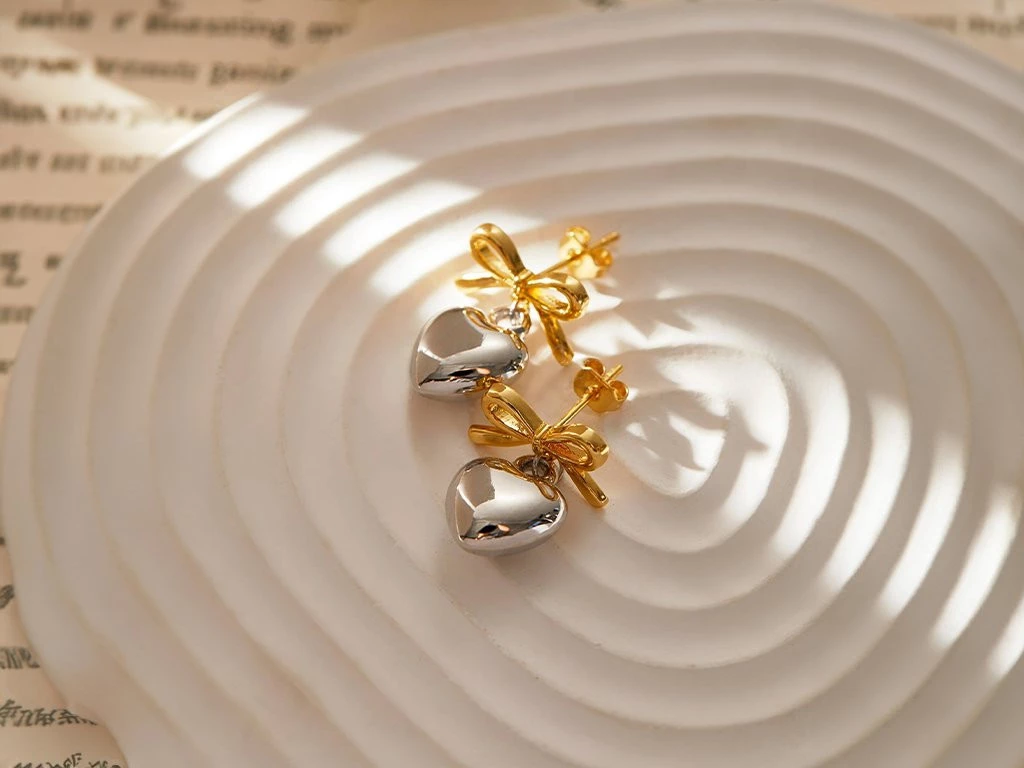 ARO BRONCE MONIO Y CORAZON INFLADO DORADO Y PLATEADO X 1 PAR